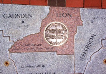 Close up photo of prime meridian monument at Cascades Park
