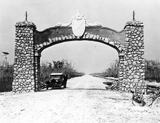 Photo of stone archway on Tamiami Trail marking boundary of Dade and Collier counties